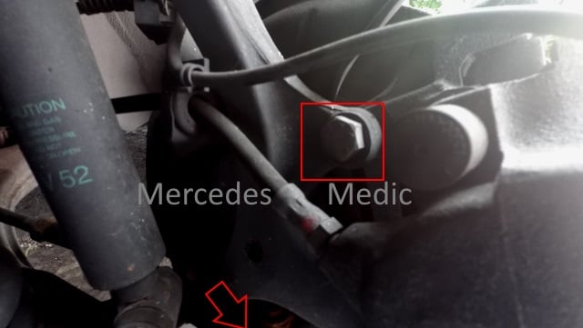 Remove two large bolts using breaker bar to get to wheel bearing